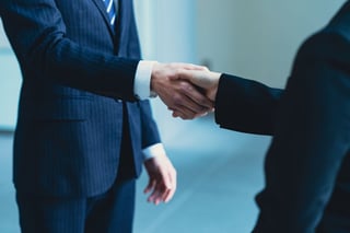 Businessmen shaking hands, professional partnership and collaboration