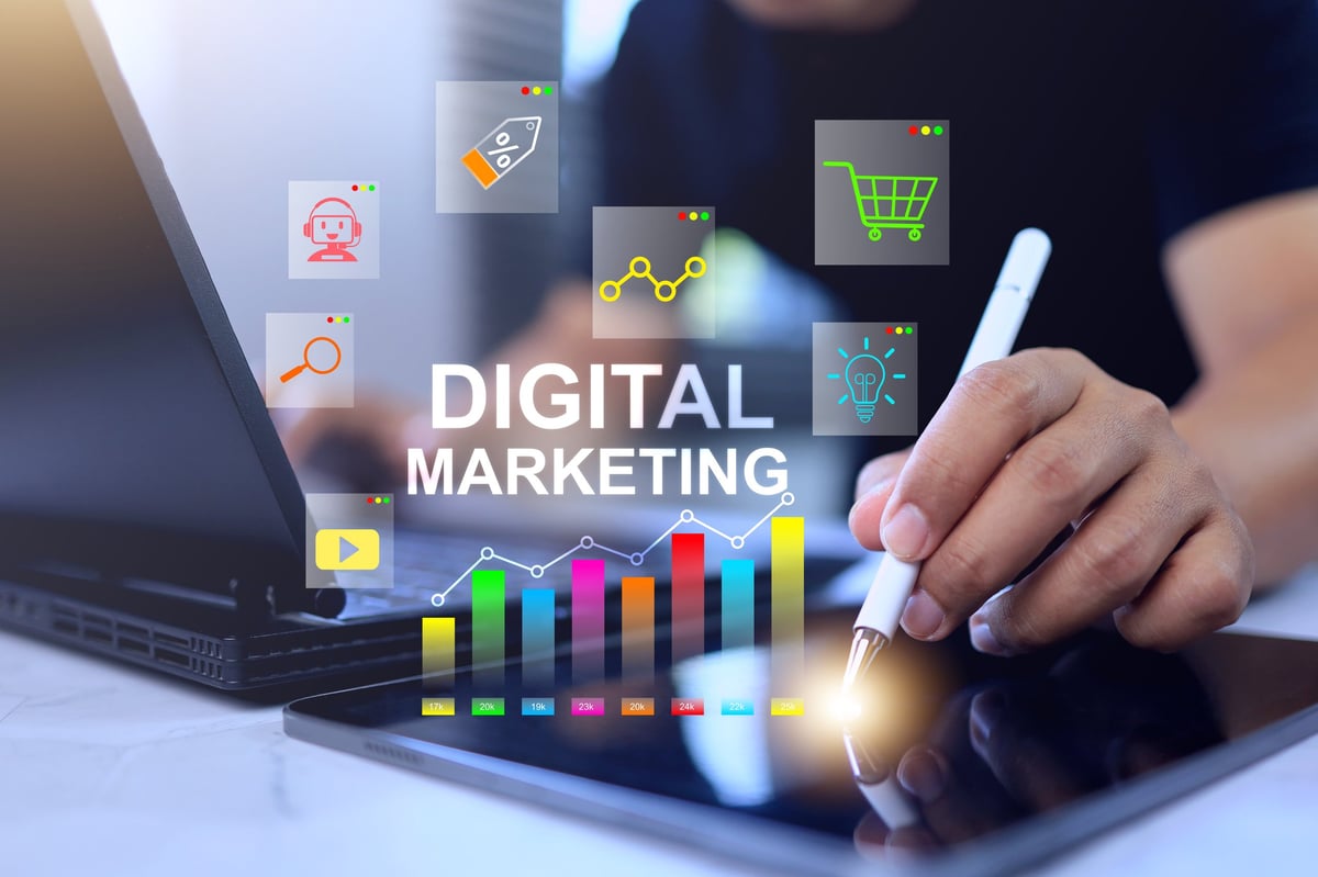 Digital marketing concept with man working on tablet analyzing data market analysis and social media strategy planning